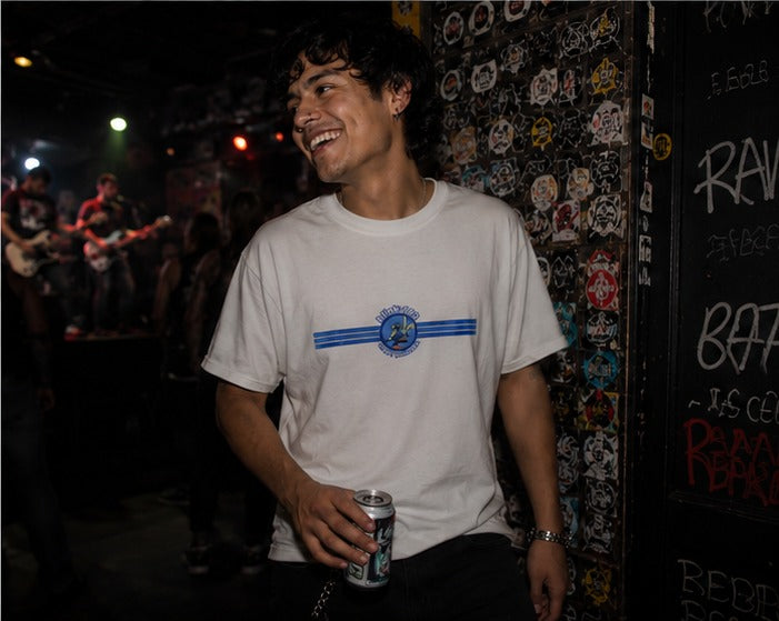 Man wearing the Blink-182 Crappy Punk Rock T-shirt at a punk gig near the stage