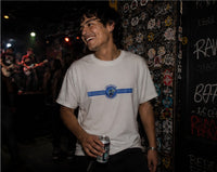 Thumbnail for Man wearing the Blink-182 Crappy Punk Rock T-shirt at a punk gig near the stage