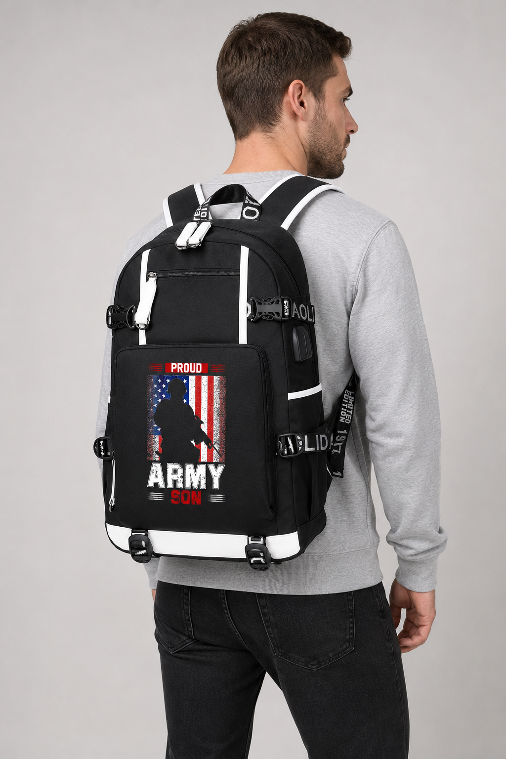 Adult model wearing Proud Army Son American Flag black backpack, three-quarter rear view