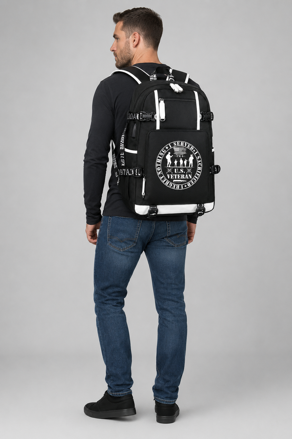 Adult model wearing U.S. Veteran Service Badge black backpack, three-quarter rear view