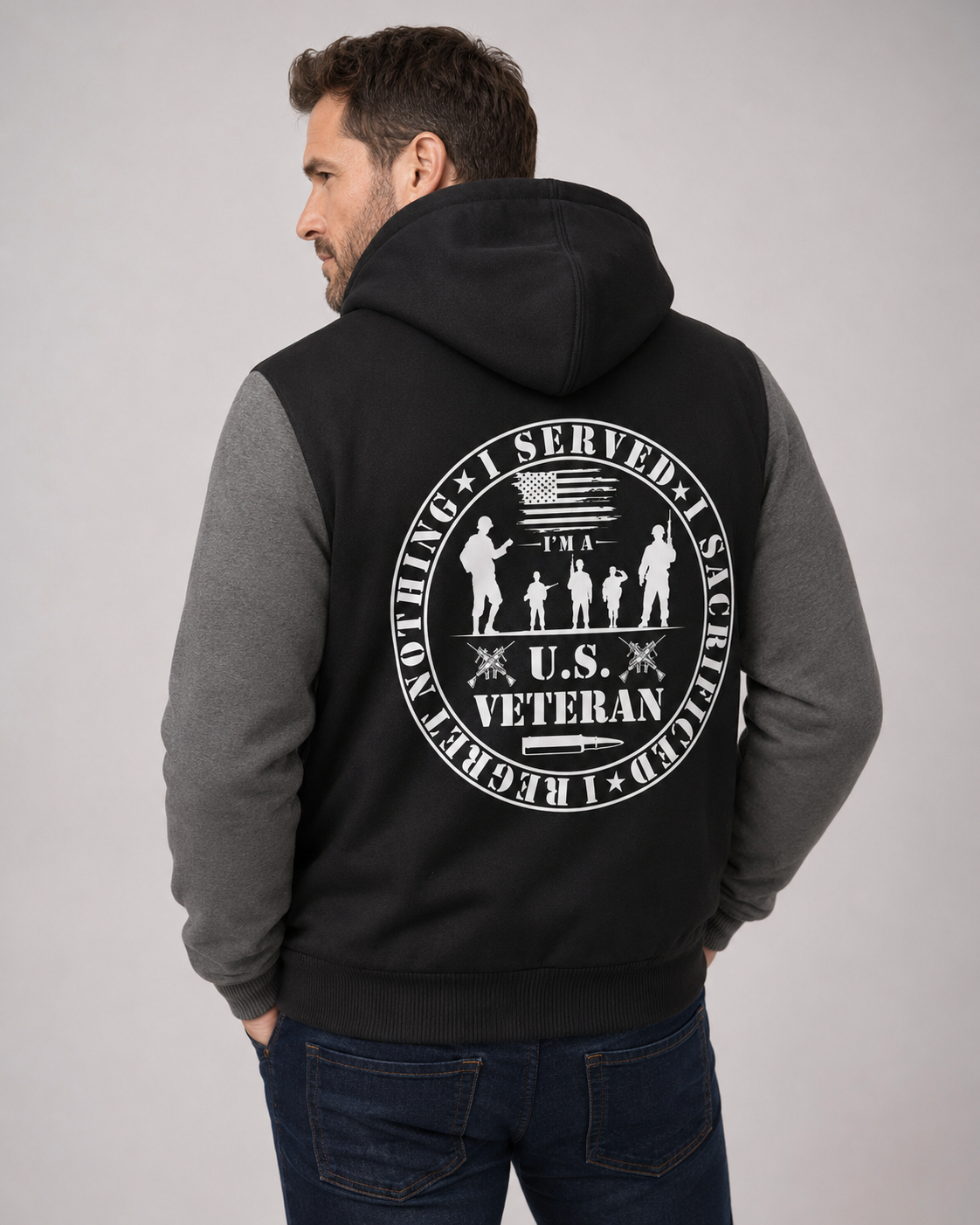 Adult model wearing U.S. Veteran Service Badge black and gray fleece jacket, three-quarter back view