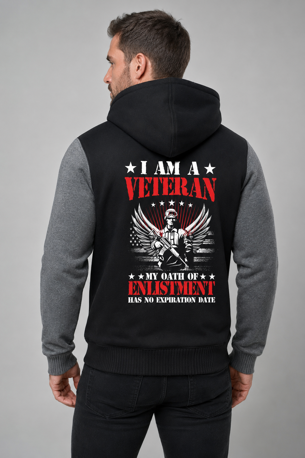Adult model wearing I Am a Veteran Enlistment Eagle black and gray fleece jacket, three-quarter back view