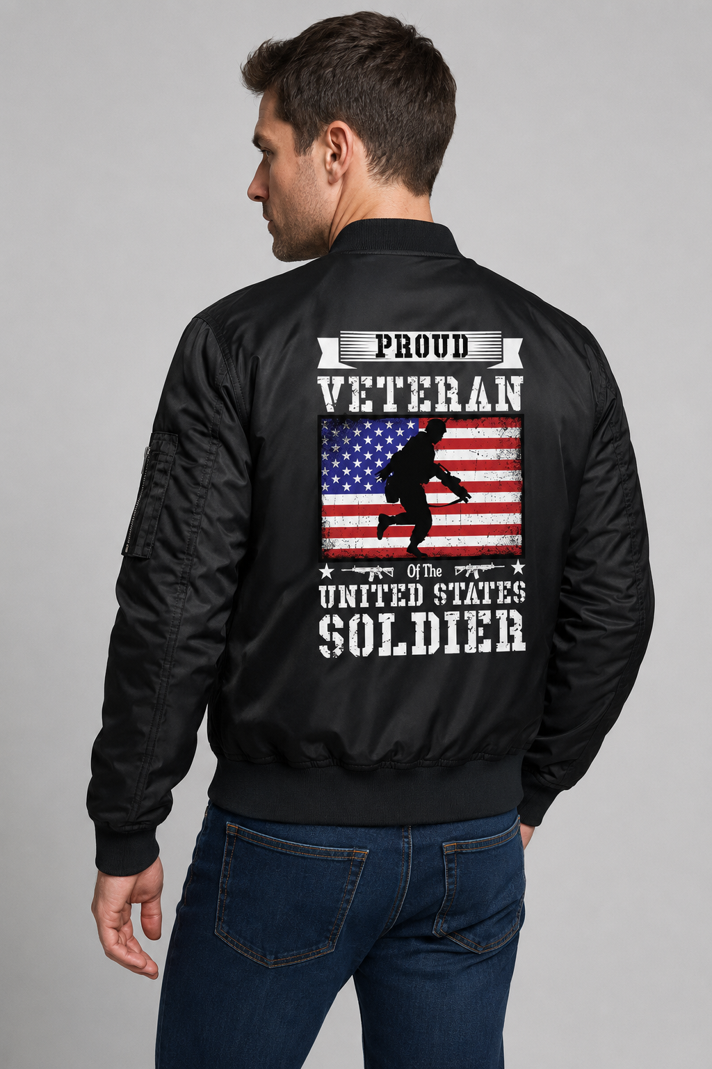 Adult model wearing Proud Veteran U.S. Soldier Flag black bomber jacket, three-quarter back view
