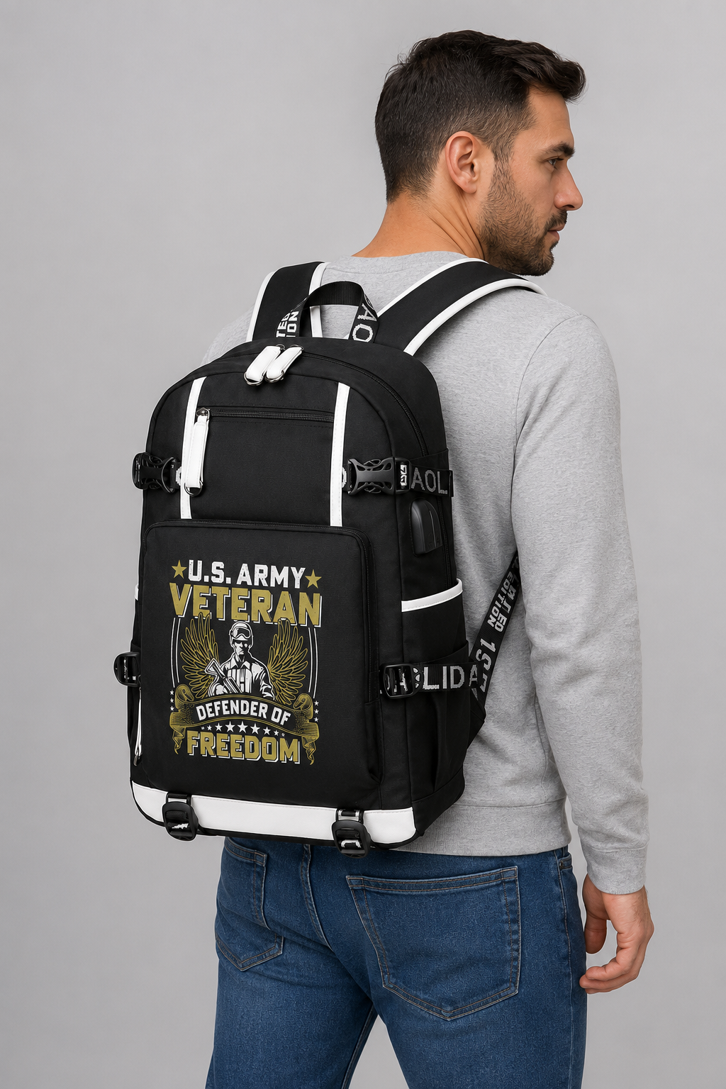Adult model wearing U.S. Army Veteran Defender of Freedom black backpack, three-quarter rear view