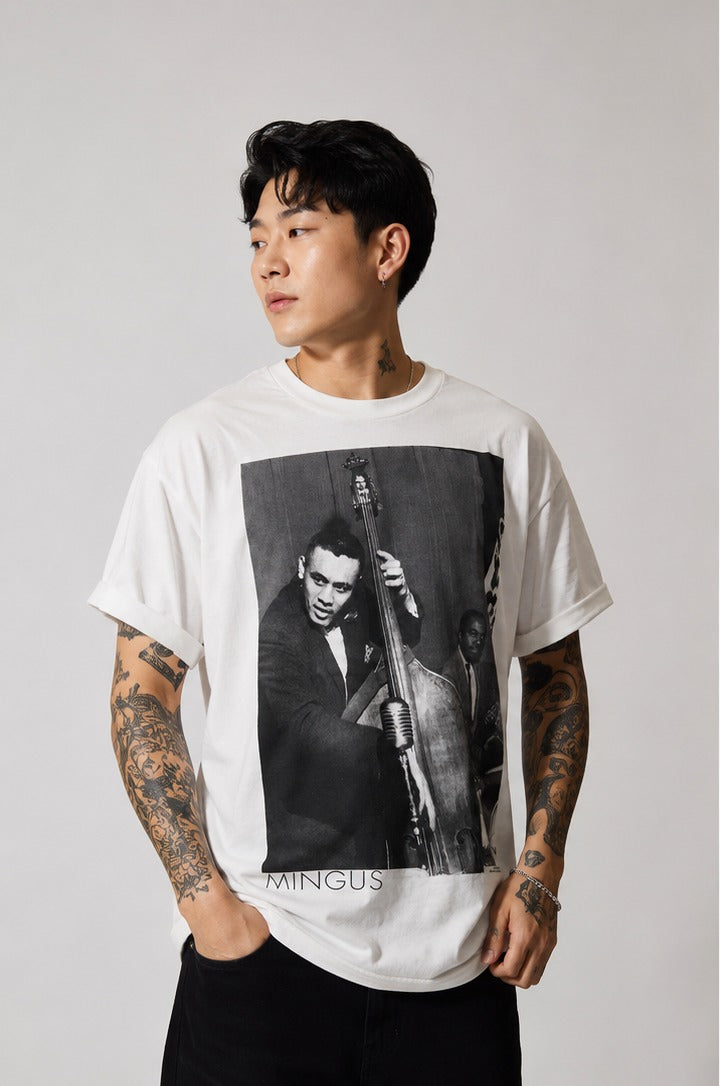 Model wearing the white Charles Mingus jazz portrait T-shirt, bassist Charles Mingus printed on the front